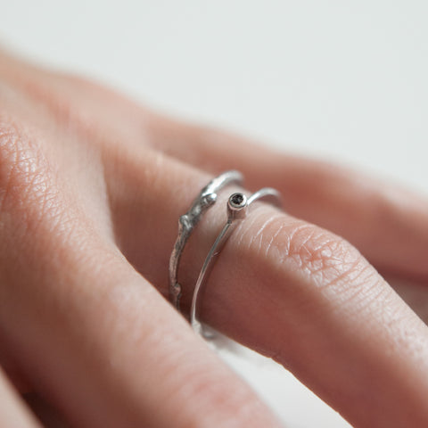 Thin branch ring on hand